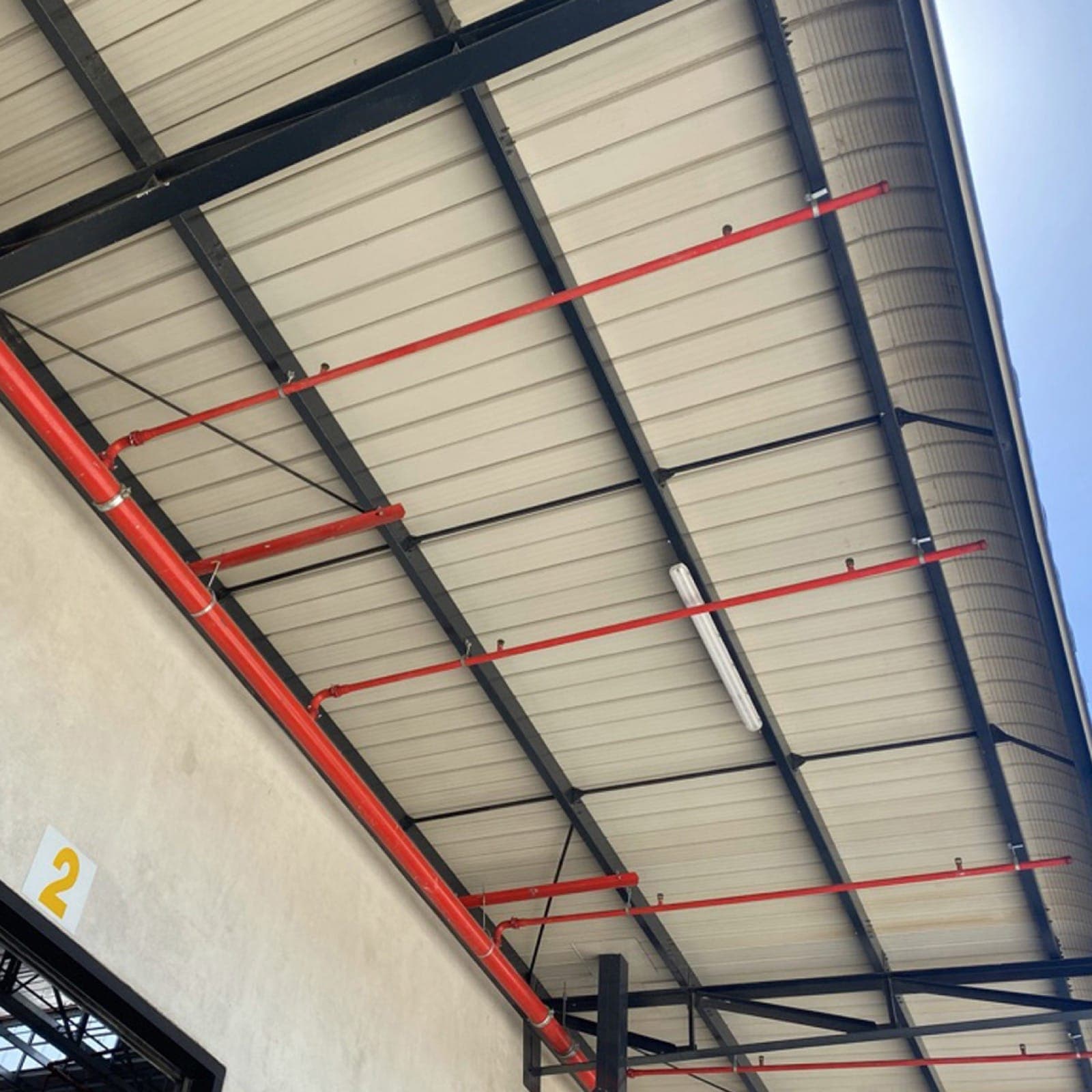 Spectre Net netting protecting commercial beams and signage structures